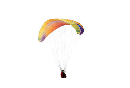 The sportsman flying on a paraglider. Beautiful paraglider in flight on a white background. isolatedの写真素材
