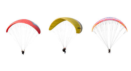 collection Bright colorful parachute isolated on white background,  The sportsman flying on a paraglider. Concept of extreme sport, taking adventure challenge.の写真素材