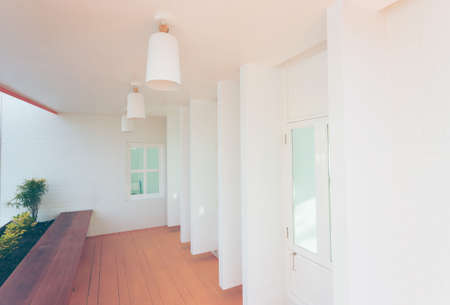 White house balcony deck and white window. A quiet porch of a suburban home.  modern home terraceの写真素材