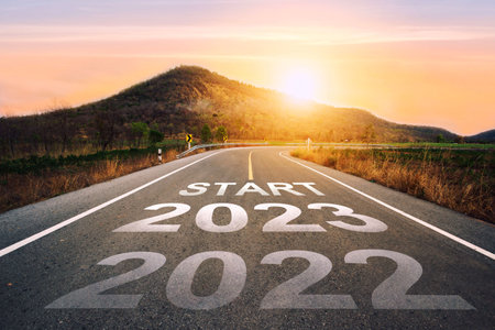 Start 2023 written on highway road in the middle of empty asphalt road of asphalt road at sunset.Concept of planning and challenge, business strategy, opportunity ,hope, new life change.for 2022-2023.の写真素材
