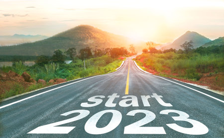 Start 2023 written on highway road in the middle of empty asphalt road of asphalt road at sunset.Concept of planning and challenge, business strategy, opportunity ,hope, new life cの写真素材