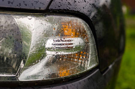 Car lights wet after the rain outdoorsの写真素材