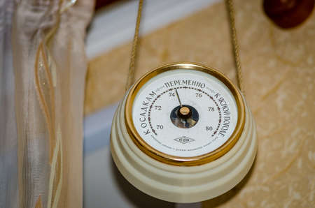 The barometer hanging on the wall in the apartment of the unit of measurement of atmospheric pressureの写真素材