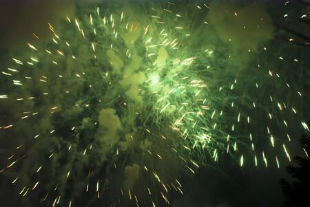 Colorful fireworks over dark sky, displayed during a celebration of Santaの写真素材