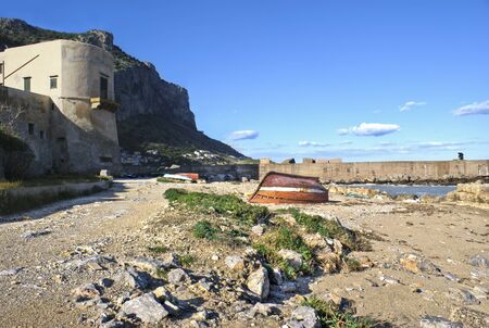 landscape of Palermo, Arenella- Sicily. old boats and fisherman in the distanceの写真素材