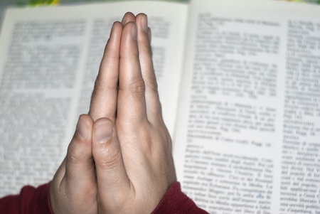 Hands in prayer of woman over the bible.の写真素材