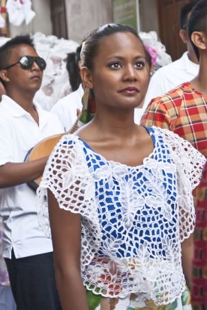 POLIZZI GENEROSA, SICILY-AUGUST 21: Woman of Philippine folk group at the International "Festival of hazelnuts",parade through the city: August 21, 2011 in Polizzi Generosa,Sicily, Italyのeditorial素材