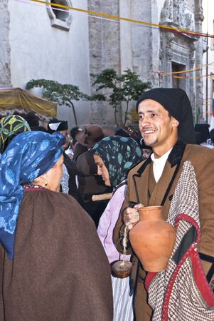 POLIZZI GENEROSA, SICILY-AUGUST 21: Portuguese folk group at the International "Festival of hazelnuts", parade through the streets of the country :August 21, 2011 in Polizzi Generosa,Palermo, Sicily, Italyのeditorial素材