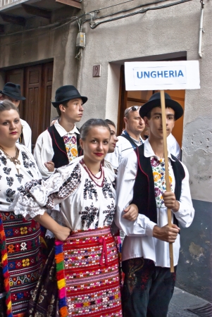 POLIZZI GENEROSA, SICILY-AUGUST 21: Hungarian folk group at the International "Festival of hazelnuts", parade through the city : August 21, 2011 in Polizzi Generosa, Sicily, Italyのeditorial素材