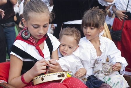 POLIZZI GENEROSA, SICILY - AUGUST 19:children undefined from sicilian folk group at the International "Festival of hazelnuts": August 19, 2012 in Polizzi Generosa,Sicily, Italyのeditorial素材