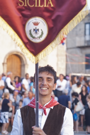 POLIZZI GENEROSA, SICILY - AUGUST 19:sicilian folk group at the International "Festival of hazelnuts" parade and dance trought the city: August 19, 2012 in Polizzi Generosa,Sicily, Italyのeditorial素材