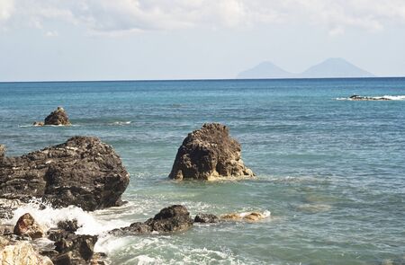 view of the Aeolian Islands from the Brolo beach in the province of Messina, Sicilyの写真素材
