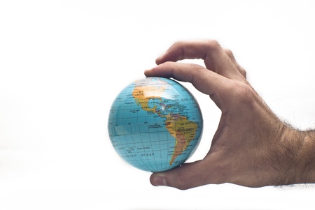 Globe ,earth in human hand, isolated on whiteの写真素材