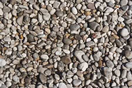 All rounded tiny pebbles from beach, a natural backgroundの写真素材