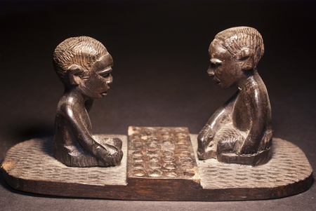 African wooden figures depicting a game of checkersの写真素材