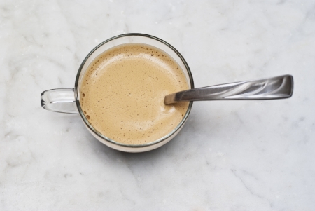 cup of italian coffee isolated on white marble backgroundの写真素材