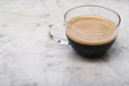 cup of italian coffee isolated on white marble backgroundの写真素材