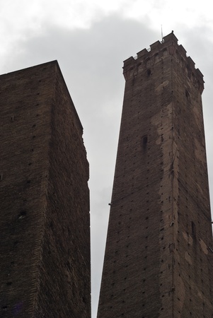 Due Torri - symbol of city under cloudy sky in Bologna, Italyの写真素材