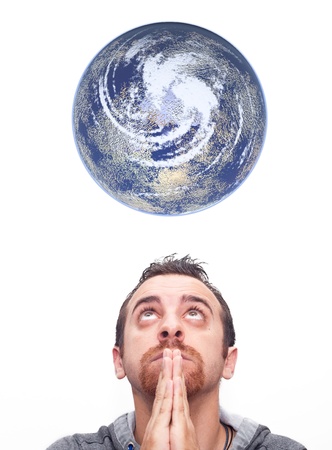 Close up man praying and looking up the earthの写真素材