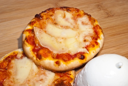 closeup of mini pizza with mozzarellaの写真素材