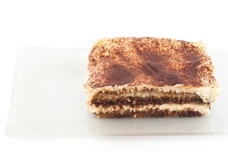 Tiramisu - Italian layered dessert, consisting of the following ingredients: mascarpone cheese, coffee (usually espresso), eggs, sugar and biscuits Savoyardy. Typically, dessert sprinkled cocoa powderの写真素材