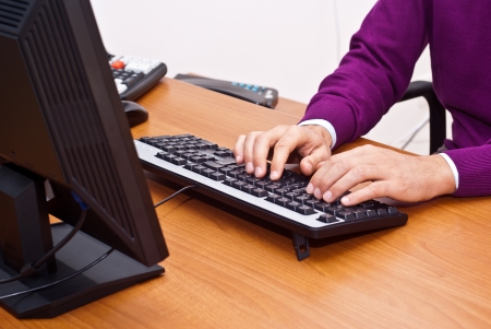 businessman sitting and using keyboard  in office. closeupの写真素材