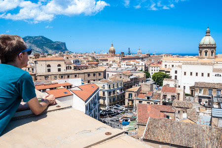 young tourists enjoying the view of the city from above. Palermo, Sicily, Italyの写真素材