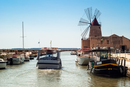 Mozia salt flats and an old windmill.Italy, Sicily, Marsala (Trapani)のeditorial素材