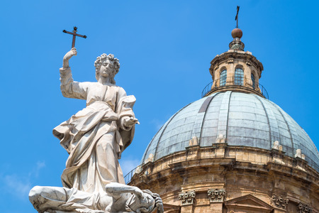 Statue of Santa Rosalia next to the cathedral of Palermo.The Saint is shown standing in the act of trampling a female figure slumped at his feet representing the plague. Sicily, Italyの写真素材