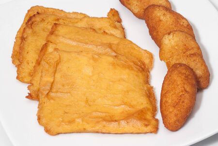 sicilian panelle and croquettes on dish. typical Sicilian food. Selective focus with shallow depth of fieldの写真素材