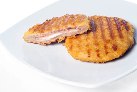 Chicken cordon bleu on the dish isolated on white background. closeupの写真素材