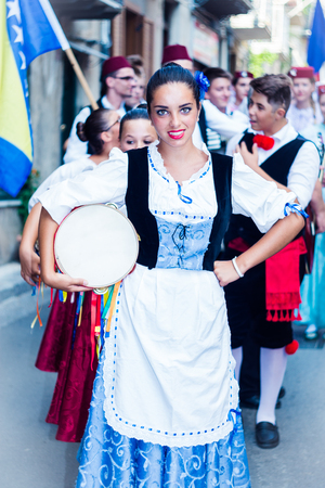 POLIZZI GENEROSA, SICILY-AUGUST 09 2015: Sicilian folk group at the Festival of hazelnuts, music and parade through the city in Polizzi Generosa, Sicily, Italyのeditorial素材