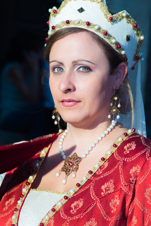 POLIZZI GENEROSA, SICILY-AUGUST 09 2015: Sicilian folk girl at the Festival of hazelnuts, music and parade through the city in Polizzi Generosa, Sicily, Italyのeditorial素材