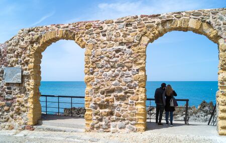 Old arches with beautiful view at Cefalu, Sicily,Italyの写真素材