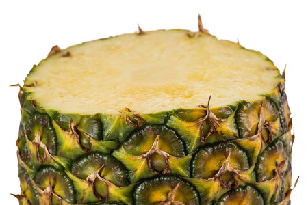 Fresh sliced pineapple. Half on white backgroundの写真素材