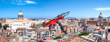 Red drone flying over the city. Palermo, Sicily, Italyの写真素材