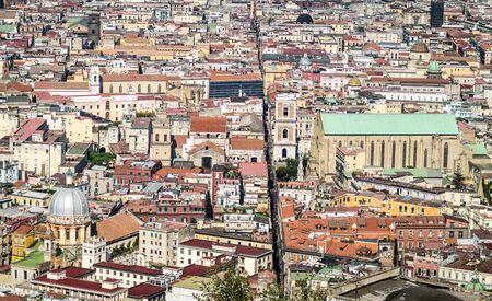 Spaccanapoli, Naples Italy.  View of Spaccanapoli street splitting city center; business district skyscrapers are in the backgroundの写真素材