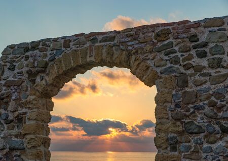 Arch overlooking the sky at sunset in CefalÃ¹, Sicily, Italy