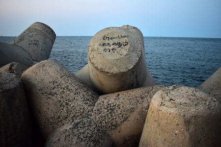 Rock beach and the pierの写真素材
