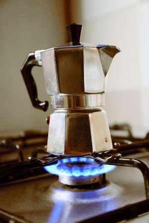 Italian vintage coffeepot on kitchen stoveの写真素材