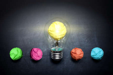 light-bulb-crumpled-paper-on-blackboard-idea-concept-backgroundの写真素材