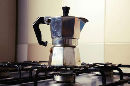 Italian vintage coffeepot on kitchen stoveの写真素材