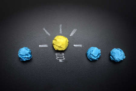 light-bulb-crumpled-paper-on-light-bulb-crumpled-paper-on-blackboard-idea-concept-backgroundの写真素材