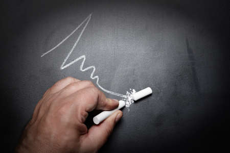 wavy-line-and-broken-chalk-stick-on-blackboard-focus-on-chalk-failure-conceptの写真素材