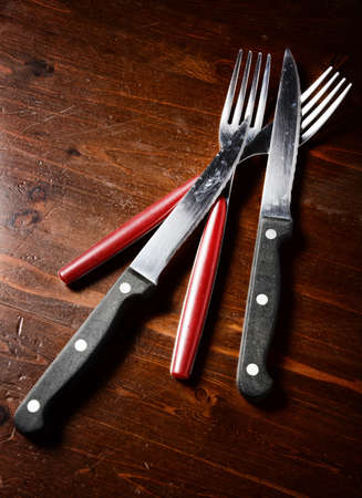 cutlery  on dark wooden table