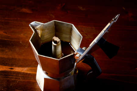 top view of checkered napkin on wooden table with red coffee cup and  vintage coffeepotの写真素材