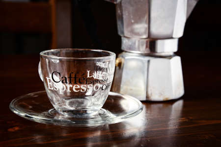 glass  coffee cup and  vintage coffeepot on dark wooden tableの写真素材