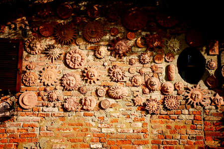 handmade collection of terracotta sun decorationの写真素材