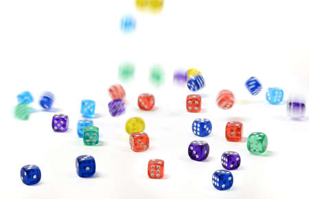 group of colored plastic dice falling