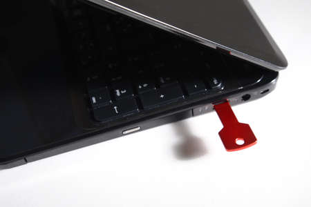 red usb key on black keyboardの写真素材